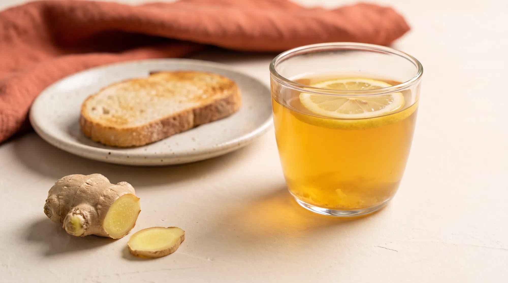 Ginger tea with lemon, fresh ginger and plain toast, gentle foods that may ease nausea on weight loss medication